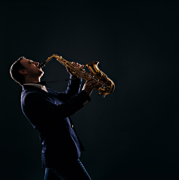 musician plays jazz at saxophone - Фото, зображення