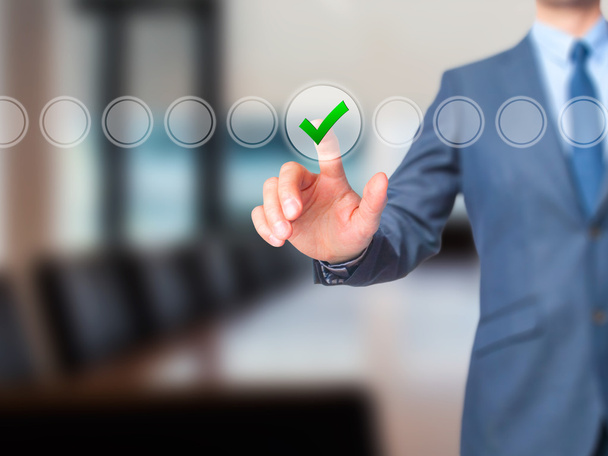 Businessman check mark on virtual screen. Finger on a checklist  - Photo, Image