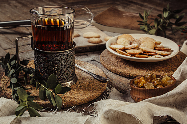 The rustic still life with tea  and sweet cookie.  - Photo, Image
