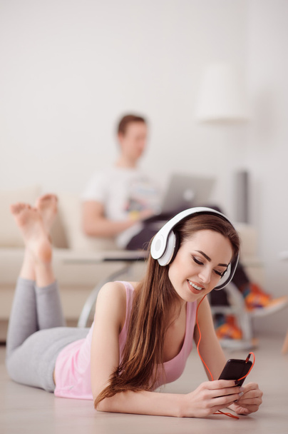 Delighted girl listening to music - Фото, зображення