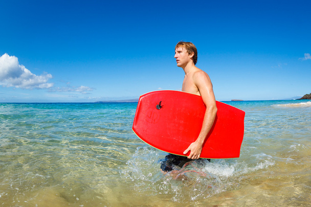 Young Man with Boogie Board at the Beach - Фото, зображення
