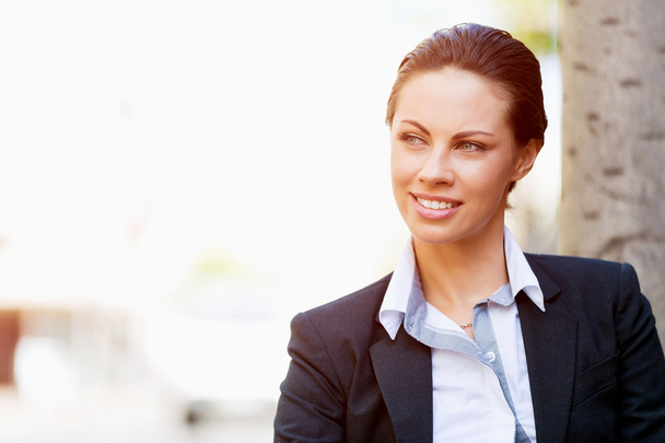 Portrait of business woman smiling outdoor - Fotó, kép