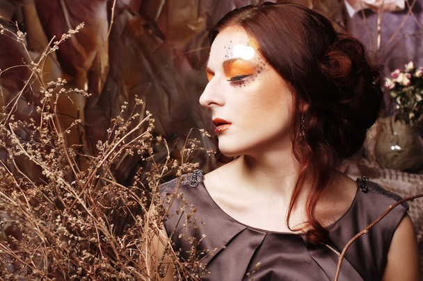 woman with bright make up with dry branches - Foto, Imagem