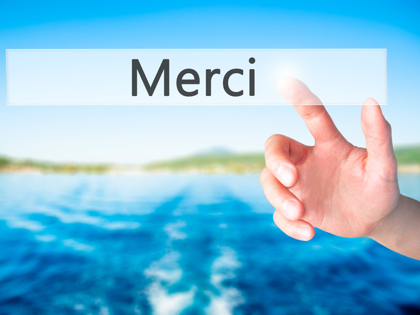 Merci - Hand pressing a button on blurred background concept on  - Photo, Image