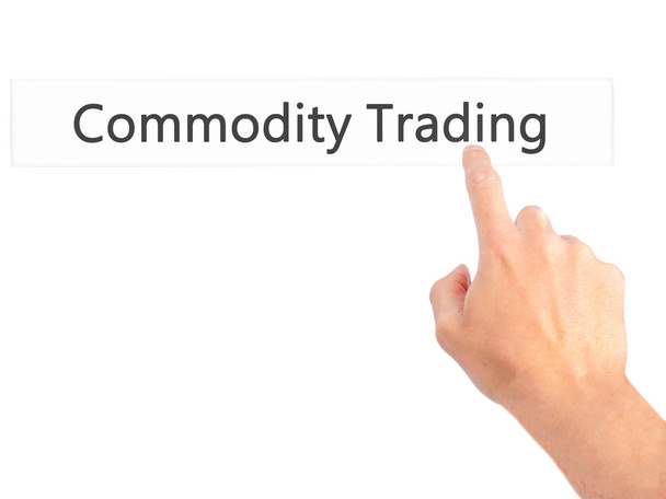 Commodity Trading - Mano premendo un pulsante su sfondo sfocato
 - Foto, immagini
