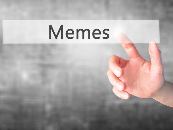 Memes - Mão pressionando um botão no conceito de fundo borrado em
  - Foto, Imagem