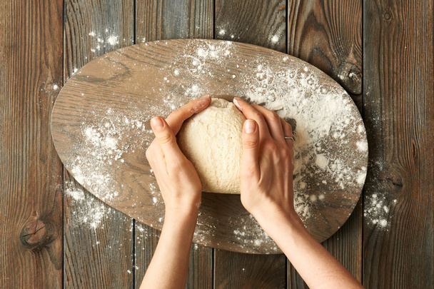 Female hands kneading dough - Fotoğraf, Görsel