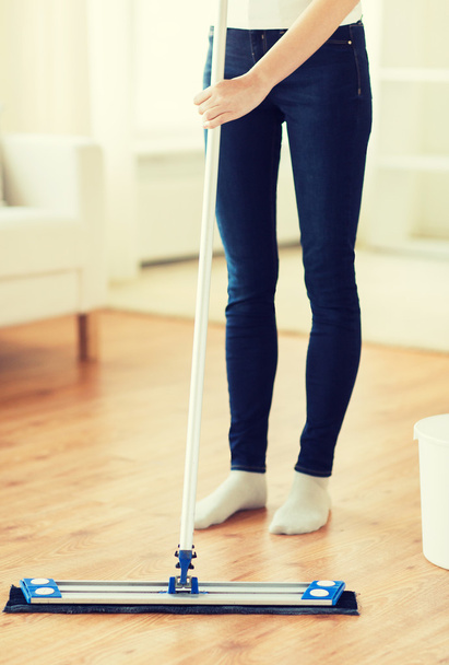 close up of woman with mop cleaning floor at home - Foto, Imagem