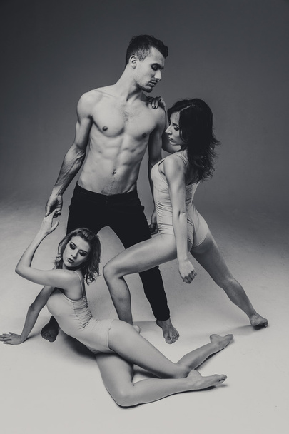 Acrobats man and two women  - Fotoğraf, Görsel