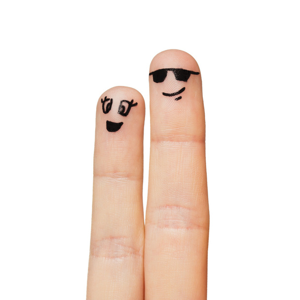 Nahaufnahme zweier Finger mit Smiley-Gesichtern - Foto, Bild
