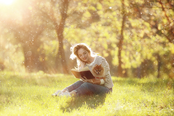 Young girl in a sunny park - Фото, зображення