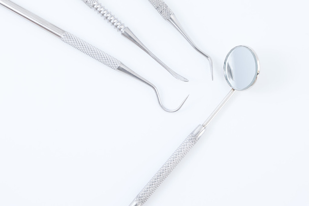 Dental tools on white background - Foto, afbeelding