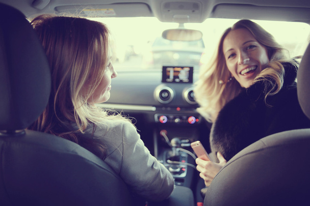 Confident women sitting in car - Foto, Imagem