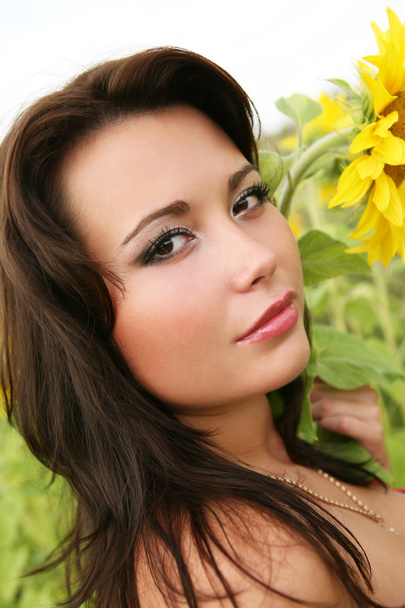 Frau mit Sonnenblumen - Foto, Bild