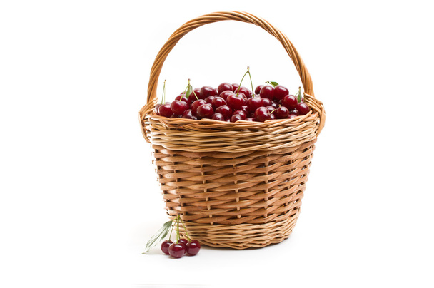 Basket full of fresh red cherry on a white background - Photo, image