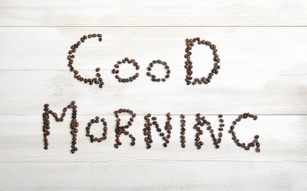 Top view of coffee beans making phrase Good morning - Фото, зображення