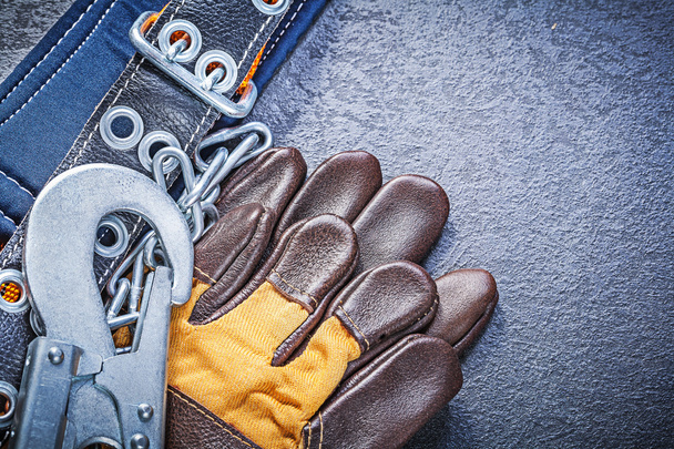 Construction safety belt and leather gloves - 写真・画像