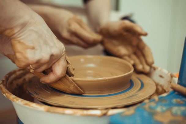 man working on a potter's wheel - Photo, Image