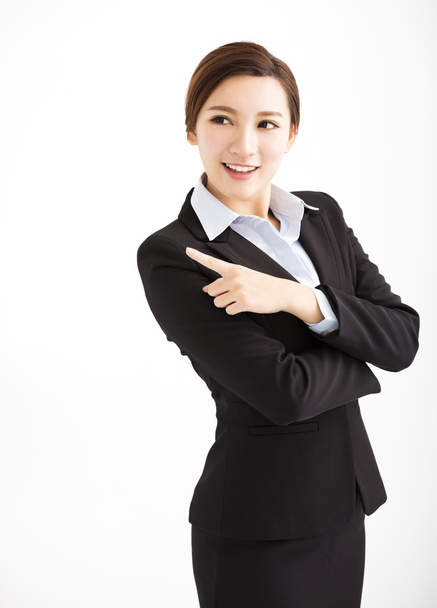 Beautiful young business woman pointing and looking - Photo, Image
