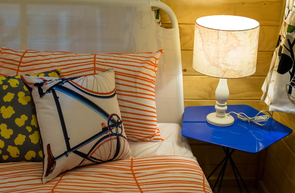 colorful pillows on bed with white lamp - Foto, imagen