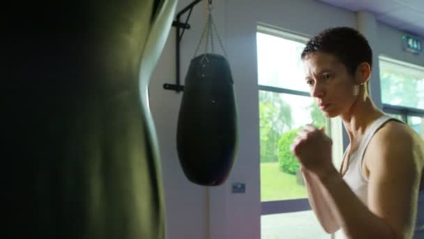 boxer training with a punch bag - Video, Çekim