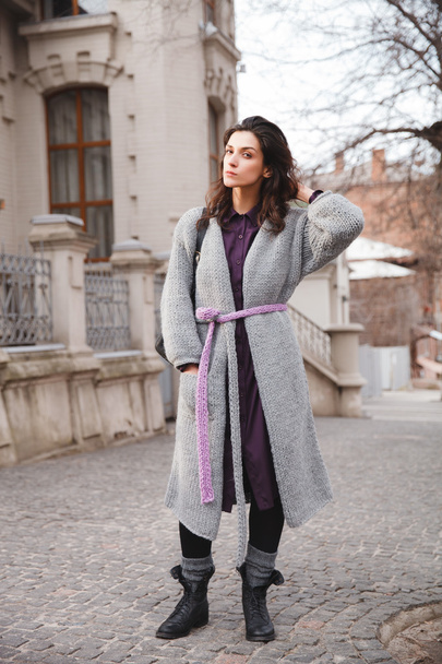 Woman wearing knitted colorful coat outdoor - Photo, Image