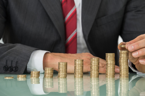 Businessman Placing Coin - Photo, image