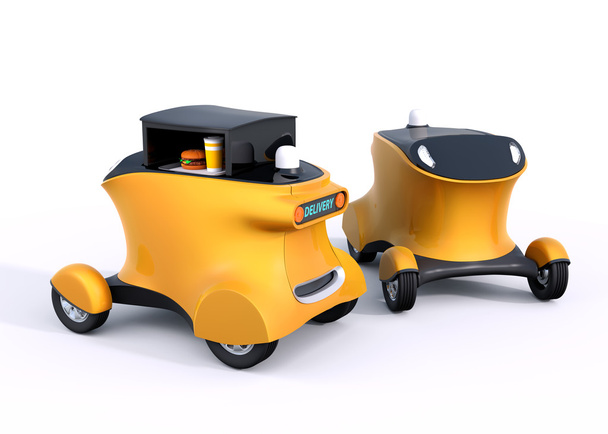 Dwóch autonomicznych hamburger dostawy samochodów robota na białym tle - Zdjęcie, obraz