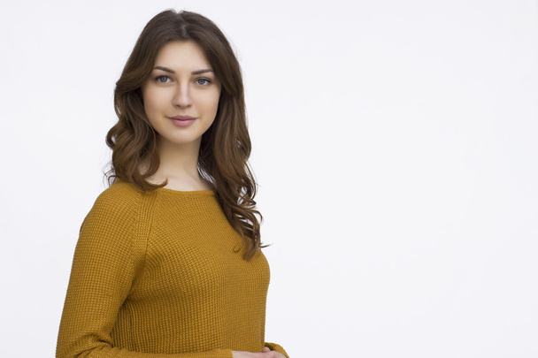 Smiling brunette woman in sweater - Photo, Image