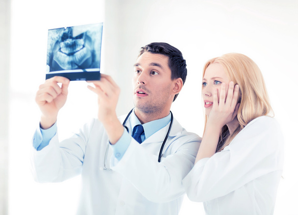 two doctors looking at x-ray - Photo, image