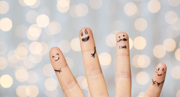 close up of four fingers with smiley faces - Foto, Imagen
