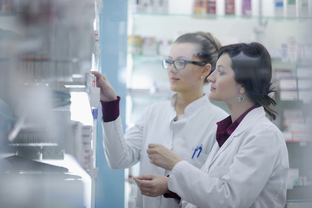 Team of pharmacist chemist woman in pharmacy drugstore - Photo, image