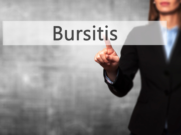Bursitis - Empresaria pulsar el botón de mano en la pantalla táctil en
 - Foto, Imagen