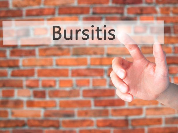 Bursitis - Mano premendo un pulsante sul concetto di sfondo sfocato
  - Foto, immagini