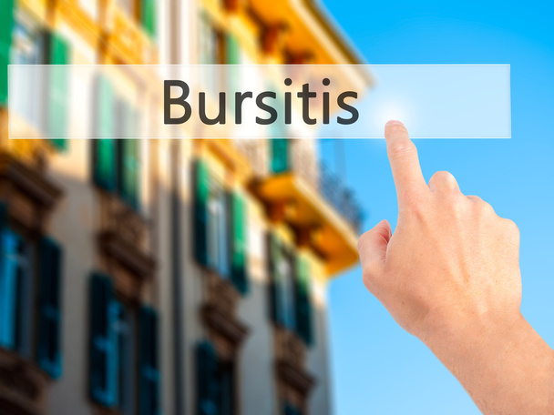 Bursitis-ręczne naciśnięcie przycisku na koncepcji niewyraźne tło  - Zdjęcie, obraz