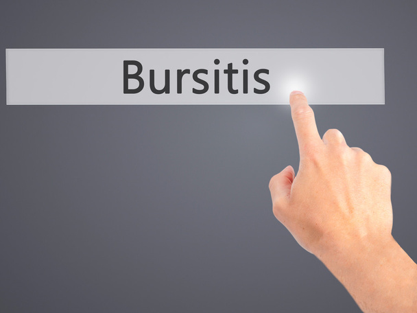 Bursitis - Mano premendo un pulsante sul concetto di sfondo sfocato
  - Foto, immagini