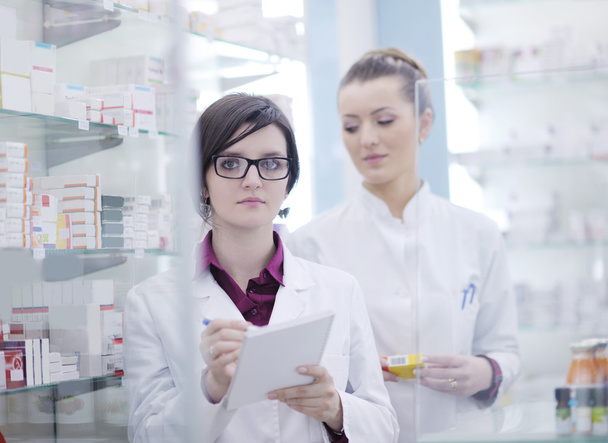 Team of pharmacist chemist woman in pharmacy drugstore - Photo, image