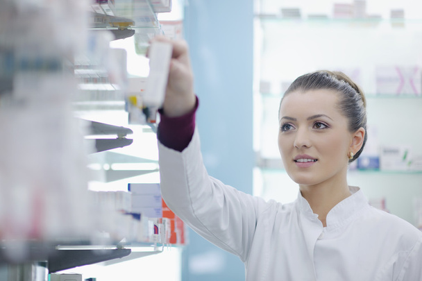 Pharmacist chemist woman standing in pharmacy drugstore - Фото, зображення