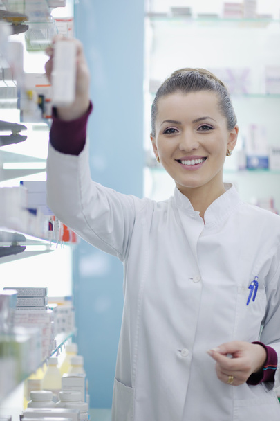 Pharmacist chemist woman standing in pharmacy drugstore - Valokuva, kuva