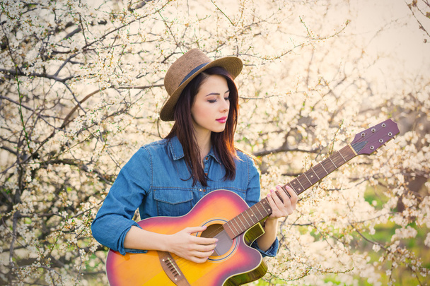 portrait of young woman with guitar - 写真・画像