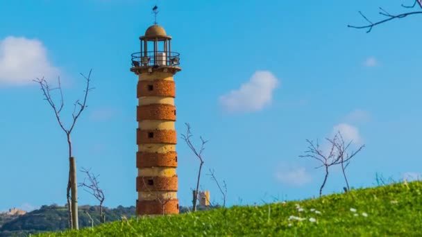 Lighthouse against blue sky with clouds - Footage, Video