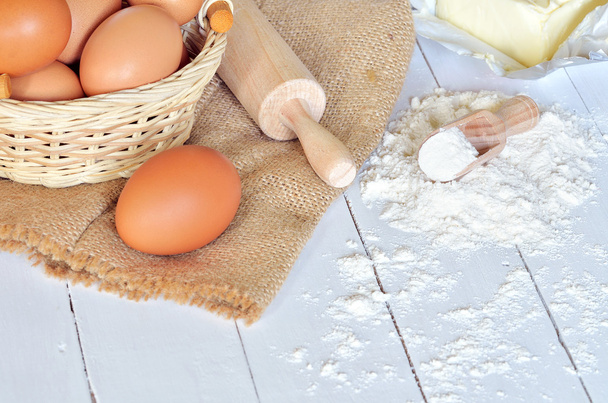 Eggs, flour, butter and rolling pin - 写真・画像