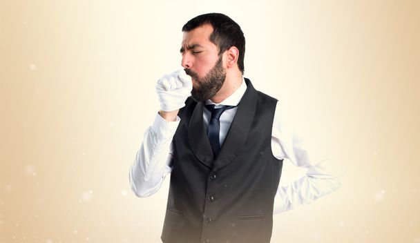 Camarero de lujo tosiendo mucho
 - Foto, imagen