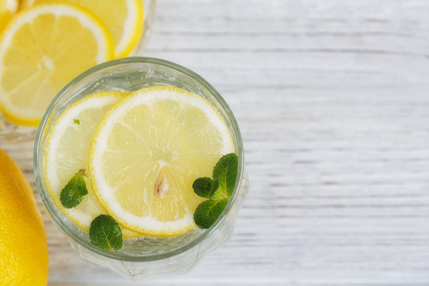 Lemonade with fresh lemon on wooden background  - Zdjęcie, obraz