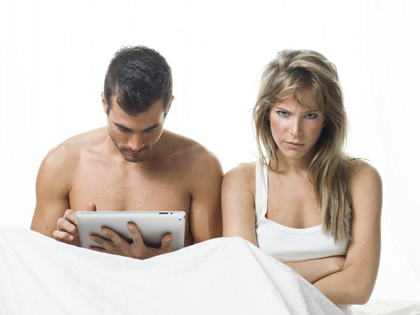 uncommunicative couple on bed in white - Φωτογραφία, εικόνα
