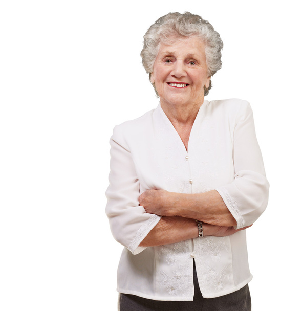 Retrato de una adorable mujer mayor de pie sobre fondo blanco
 - Foto, Imagen