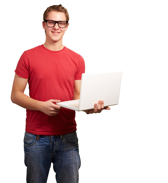 Portrait of young student man holding laptop over white backgrou - Photo, Image