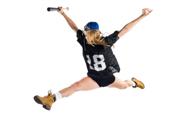 Frau springt und spielt Baseball - Foto, Bild