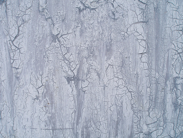 Close-up of cracked paint on the wall - Φωτογραφία, εικόνα
