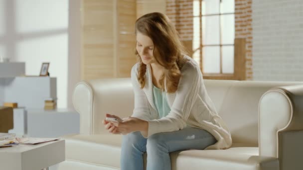 Girl chatting, communicating in social networks on smart phone - Felvétel, videó